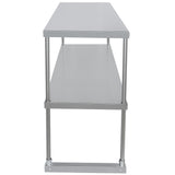 A stainless steel table viewed from the narrow end, featuring a table-mounted overshelf above two shelves supported by four cylindrical legs. The reflective surface and lower shelf provide sturdy storage in a sleek, rectangular design.