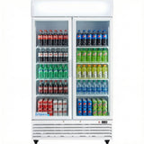 A Glass Swing Door Cooler with glass doors displays rows of soda bottles and cans, including Coca-Cola, Sprite, Pepsi, and more. The white Refrigerated Merchandiser is labeled “Empura” at the bottom, keeping drinks neatly organized on shelves.