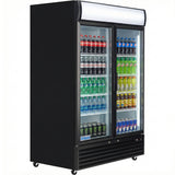 A temperature-controlled display, such as the Empura EGM-50B commercial refrigerated merchandiser, showcases rows of assorted beverages—Coca-Cola, Sprite, Monster Energy, Gatorade, Pepsi—in a sleek black fridge with two sliding glass doors and interior shelves.