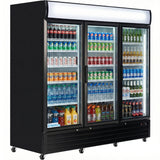A commercial glass-door refrigerated merchandiser displays rows of assorted bottled and canned drinks—sodas, water, sports drinks, and teas. The display cooler has three vertical doors, white shelves, black trim, and caster wheels for easy mobility.