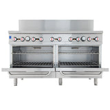 A large commercial stainless steel Double Base Gas Range with two open oven compartments, six control knobs along the top, and metal racks inside each oven. The natural gas range stands on four sturdy legs and has a backsplash panel behind the controls.