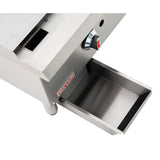 Close-up of a Heavy Duty Gas Griddle featuring a drip tray partially pulled out and a temperature control knob above it. The stainless steel appliance has clean edges, sturdy build, and the Empura brand name displayed on the front.