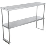 A table-mounted, stainless steel double-tier overshelf features two flat rectangular shelves supported by four cylindrical legs, providing extra storage space commonly used in commercial kitchens for organizing supplies or equipment.