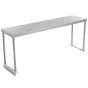 A long, rectangular stainless steel table with a smooth, flat surface and four cylindrical legs. The minimalist design features no visible drawers or shelves, while the metal construction and optional table-mounted overshelf add to its modern, industrial appeal.