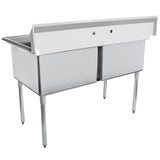 A modern, industrial stainless steel two compartment sink with tall backsplash, two deep bowls, and four cylindrical legs. Open at the front beneath the basins, this commercial kitchen sink reveals its sturdy understructure and is empty.