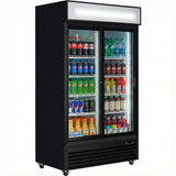 A commercial refrigerated merchandiser with black glass sliding doors, stocked with Coke, Pepsi, Sprite, Mountain Dew, Red Bull, Monster, Gatorade, and Snapple. This fridge features two sliding doors and sits on wheels for easy mobility.