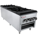 The Empura commercial gas stove features four black cast iron burners and metallic control knobs, ideal for use as a stock pot range. Made of stainless steel, it runs on natural gas and has an open storage shelf below with sturdy metal legs.