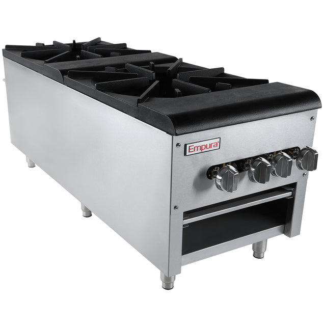 The Empura commercial gas stove features four black cast iron burners and metallic control knobs, ideal for use as a stock pot range. Made of stainless steel, it runs on natural gas and has an open storage shelf below with sturdy metal legs.