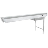 A long, stainless steel commercial sink with a built-in backsplash features a drying rack at the left end and an undercounter shelf. The minimalist, industrial design includes two metal legs and a stainless steel worktop, perfect for restaurant or kitchen use.