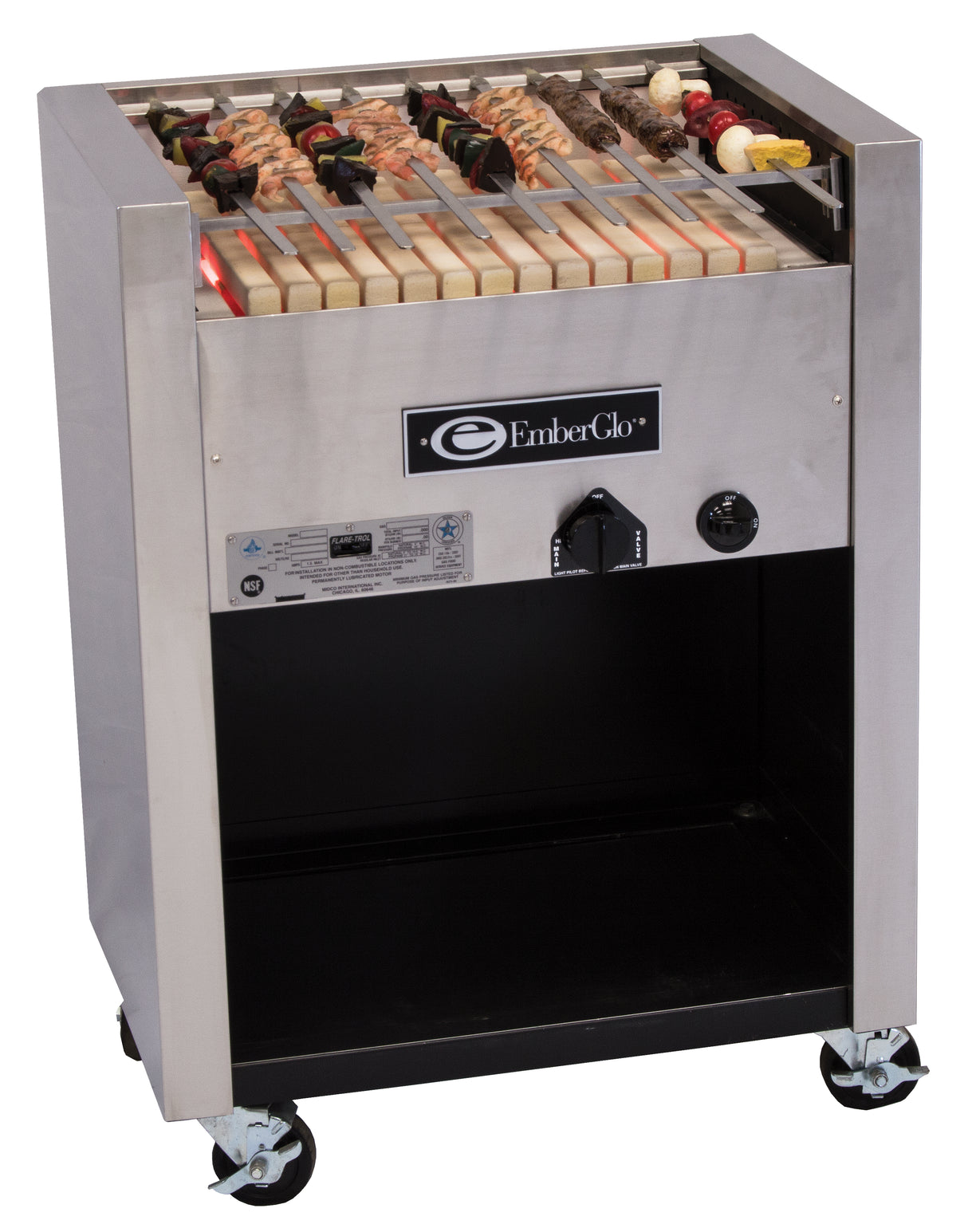 A stainless steel Kabob Charbroiler EmberGlo grill with skewers of meat and vegetables on a ceramic hearth, featuring a control knob and vents on the front, stands on four caster wheels with open storage below. Operates on natural gas.
