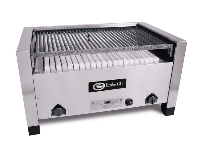 A commercial stainless steel charbroiler with parallel metal grates on top, a ceramic hearth of white briquettes beneath, and two black control knobs on each side. EmberGlo logo is displayed on the front center panel.