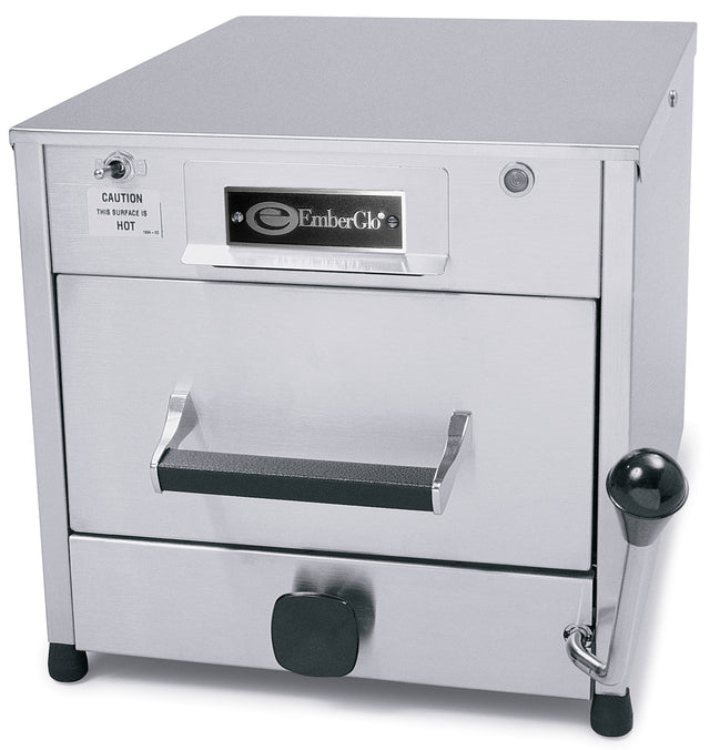 A stainless steel electric countertop steamer by EmberGlo with a front-facing door handle, control knob, caution label, and side lever. This box-shaped Top Injecting Steamer boasts a smooth metallic finish and industrial design for professional kitchens.