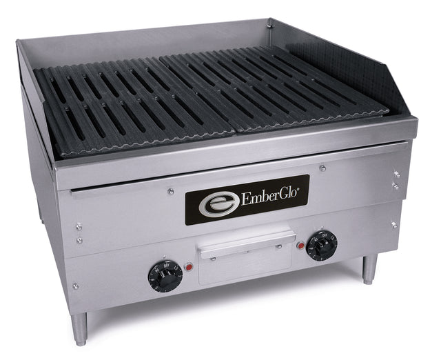 A commercial stainless steel EmberGlo countertop charbroiler with two black control knobs, a vented grill top, raised sides, back splash guard, and sturdy legs. The front displays the EmberGlo logo in black and white.