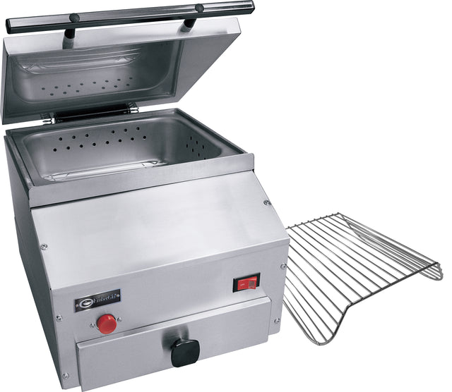 A stainless steel countertop steamer with a partially open lid, perforated steaming tray inside, control knob, red power switch, and a removable wire rack beside it. This industrial tortilla steamer features a sleek design on a white background.