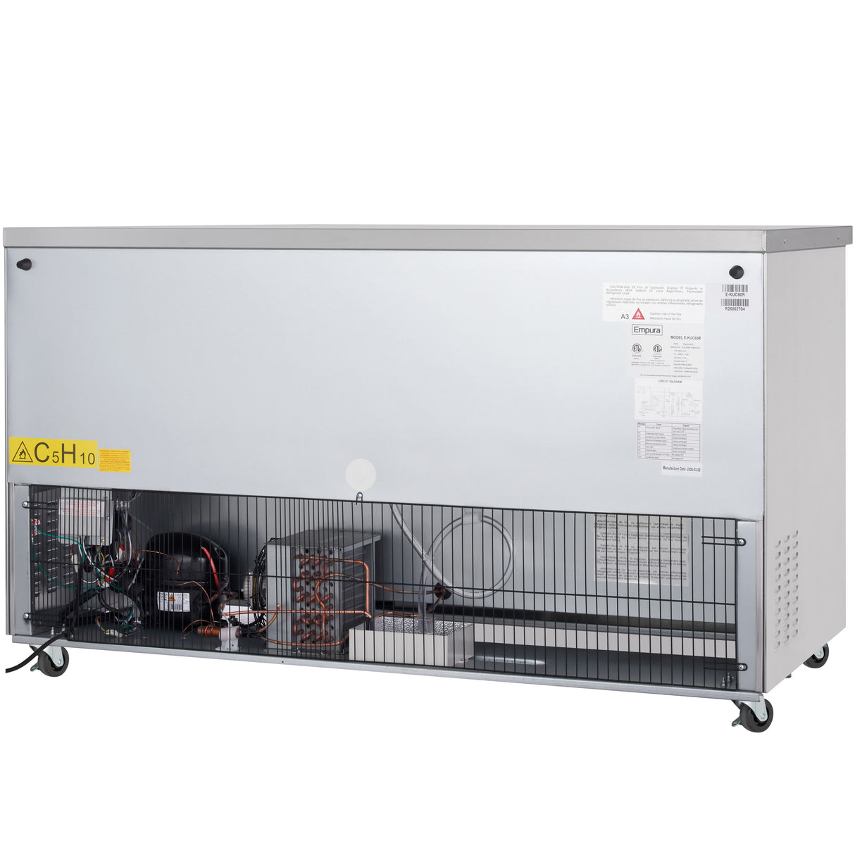 An Empura Refrigeration commercial freezer with 13.2 cu. ft. capacity features its lower front panel open, showing wiring, compressor, and coils. The silver undercounter unit is on wheels with warning and info labels visible inside and on the front.