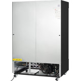 A large, industrial gray metal cabinet—resembling a commercial freezer—with its lower front panel open, revealing internal mechanical and electrical components. The unit has four wheels for mobility and a yellow caution label reading C.SH 10 on the lower left.