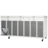 A large, white solid lid chest freezer with three handles on top, ventilation grilles along the front, a small compressor unit on the left side, control panel above the grille, and four wheels at the bottom—ideal for any commercial kitchen freezer setup.