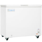 A large, white solid lid chest freezer on wheels with the Empura refrigeration brand displayed on the top left. It features a digital control panel on the bottom right corner and a flat lid with handle. The background is plain white.