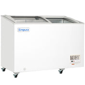The Empura commercial freezer features a white rectangular design with sliding glass doors, four caster wheels, and a vented control panel on the lower right—ideal as a chest freezer for storing frozen goods in any busy setting.