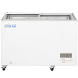A large white Empura commercial chest freezer with sliding glass doors sits on four caster wheels. The unit features a vent, control panel, and power indicator light on the lower right front side.