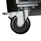 A close-up of a swivel caster wheel attached to a metal frame from an Empura Refrigeration commercial freezer, featuring a black rubber tire and shiny locking lever. The fine details and craftsmanship are highlighted by the reflective surface.