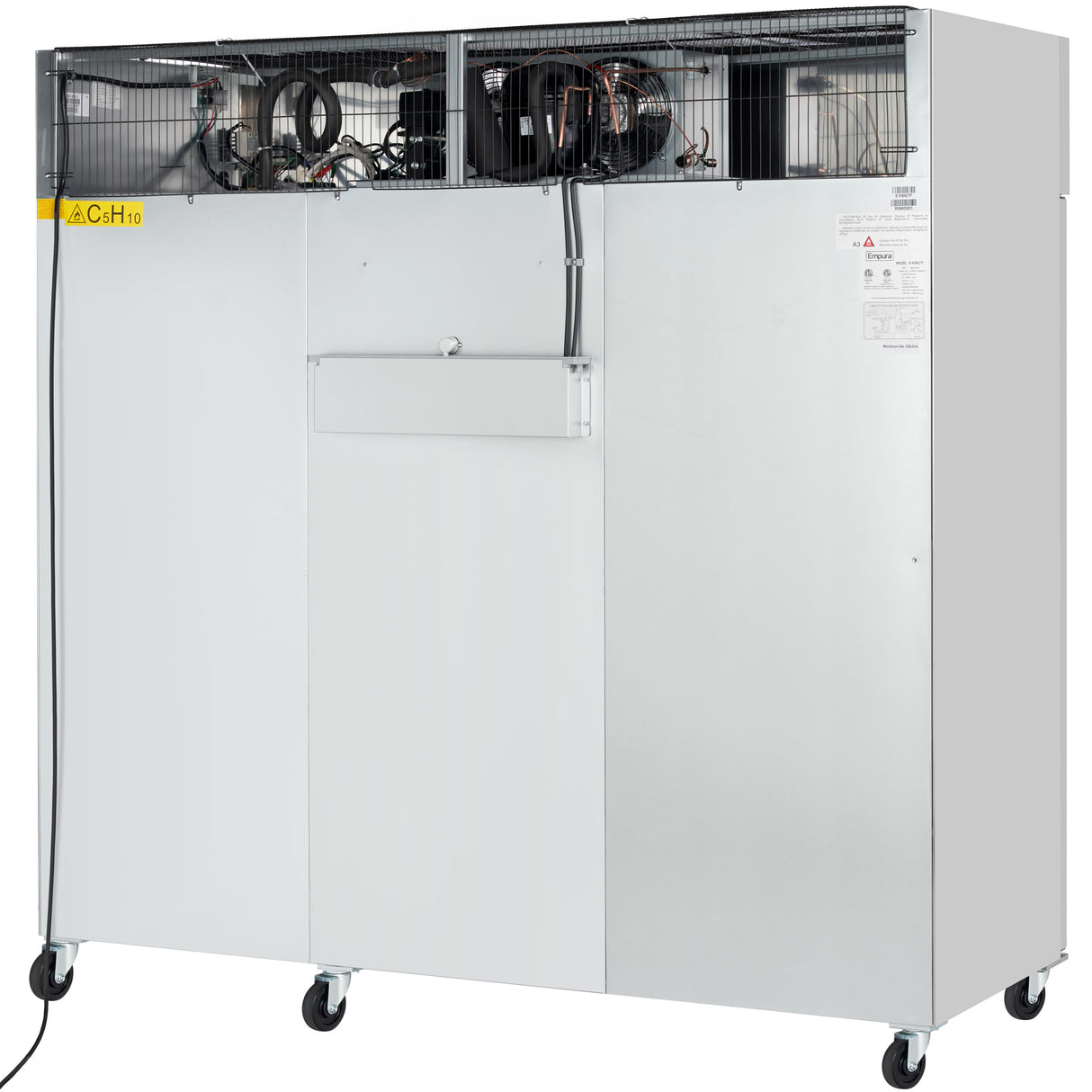 A large, industrial metal machine with a Stainless Steel exterior and exposed wires on top, mounted on four caster wheels. The Reach-In Freezer features a smooth silver front panel with a small access door and warning labels. A black power cord is visible on the left.