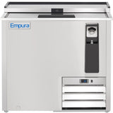 A stainless steel Empura refrigeration bottle cooler with a sliding lid, built-in bottle opener, cap catcher, digital control panel, ventilation grilles, and the Empura logo on the top left corner. The unit has a sleek, industrial design.