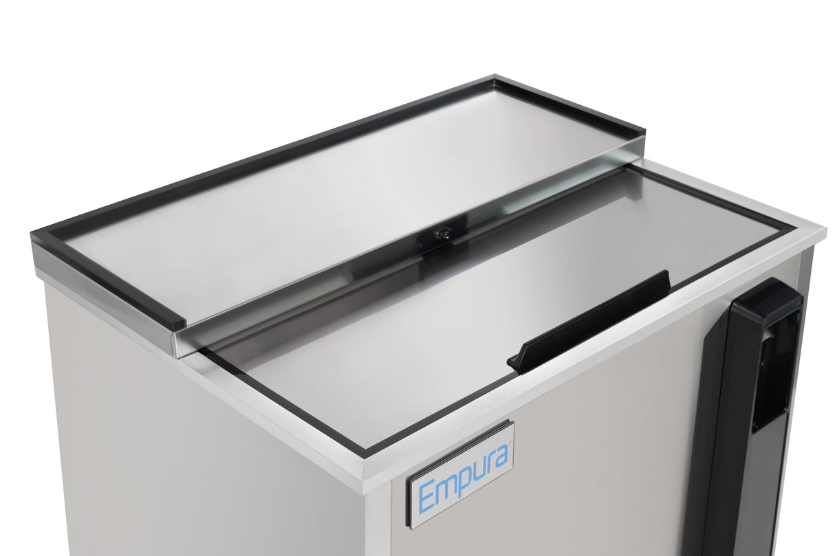 A close-up of an Empura refrigeration stainless steel bottle cooler with a sliding top lid, partially open. The rectangular unit features a handle on the right and displays the blue Empura logo on the front panel.