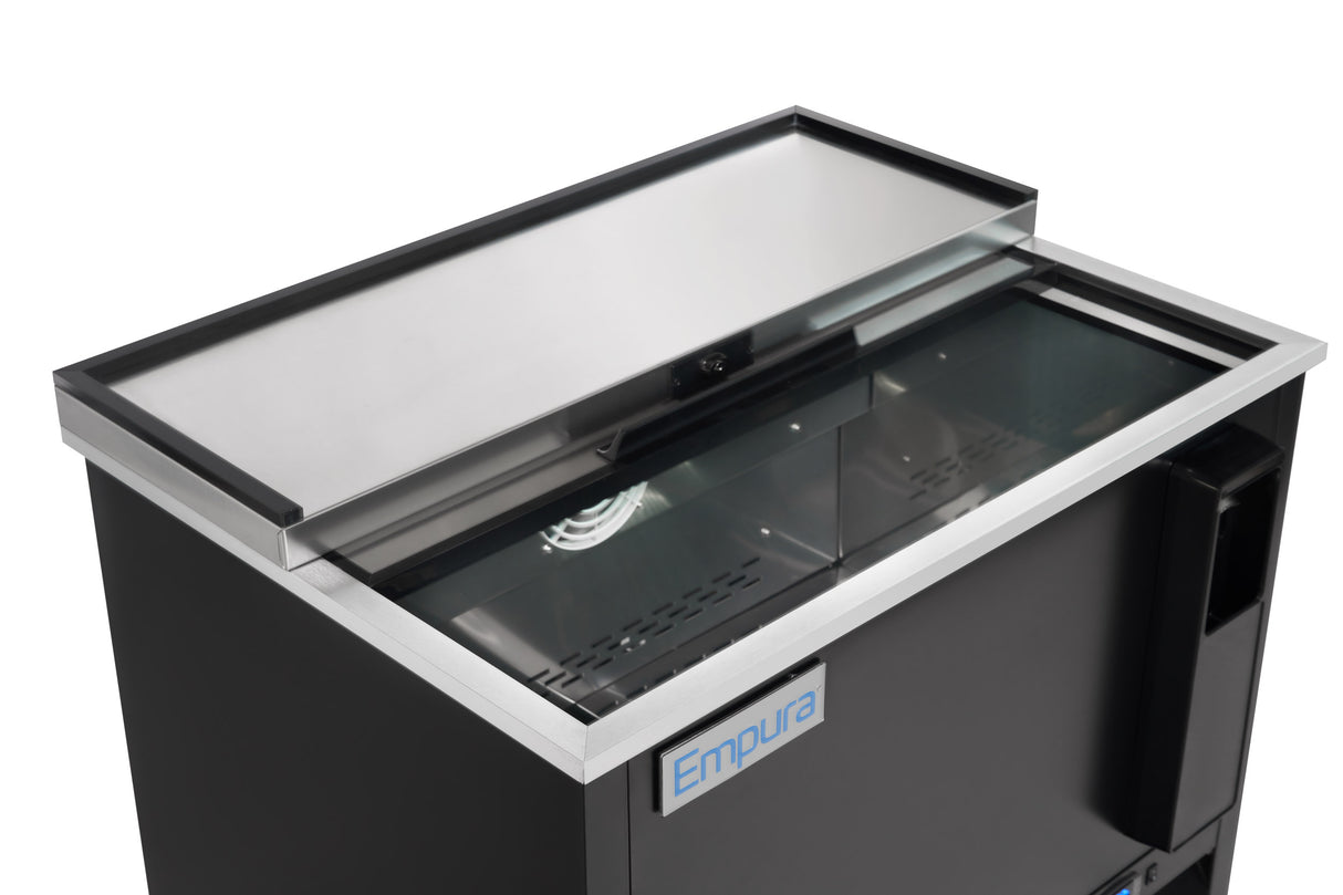 A commercial refrigeration Empura beverage cooler with a sliding lid is partially open, revealing a fan and storage for cans or bottles. The sleek black and silver exterior features an Empura logo on the front, making it a standout bottle cooler.