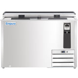 A commercial bottle cooler with two sliding lids, Empura logo on the left, and built-in bottle opener on the right. The stainless steel finish, ventilation grilles, and electronic temperature display create a clean, modern look.