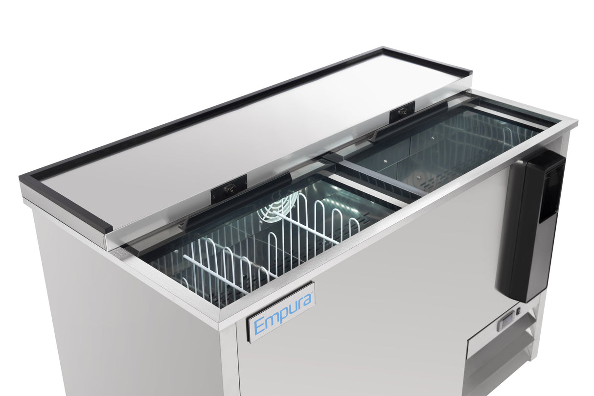 A commercial bottle cooler with dual sliding glass doors, interior shelving, and a visible cooling coil. The Empura brand logo is on the front, and a black handle is on the right side. This stainless steel bottle cooler is empty and clean.