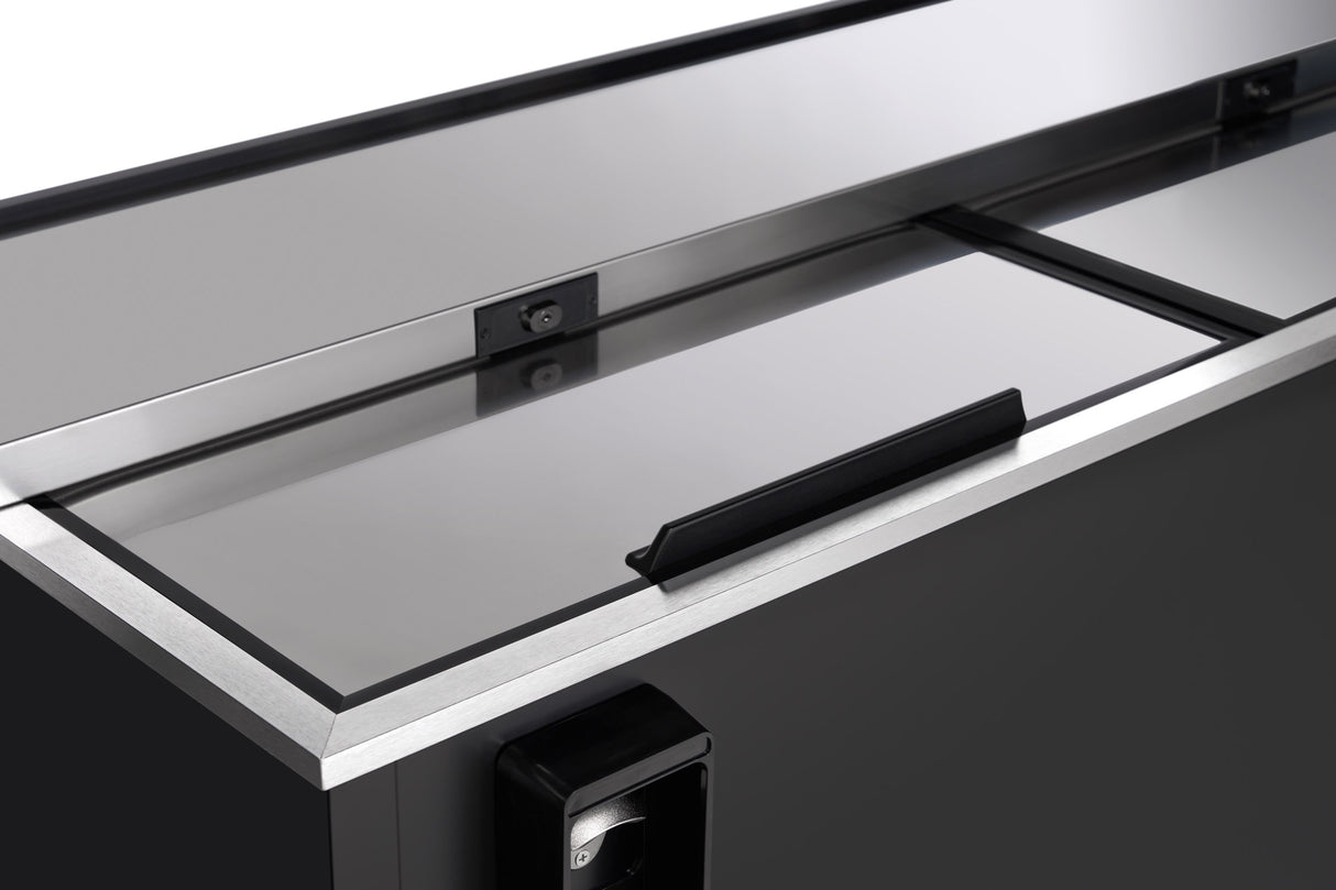 A close-up view of a sleek, black commercial refrigerator by Empura Refrigeration with a stainless steel sliding lid, recessed handle, and visible lock mechanism. The clean, reflective surface showcases modern industrial design—ideal for a bottle cooler setup.