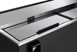A close-up view of a sleek, black commercial refrigerator by Empura Refrigeration with a stainless steel sliding lid, recessed handle, and visible lock mechanism. The clean, reflective surface showcases modern industrial design—ideal for a bottle cooler setup.