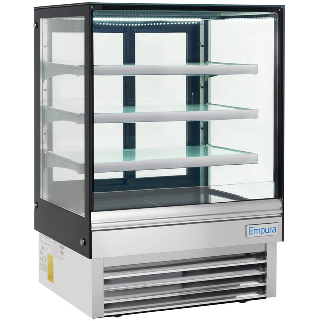 A commercial refrigerated display case with a glass front and sides, three glass shelves, and a stainless steel base. The unit features the Empura brand on the bottom right corner and bright LED lighting inside the display area.