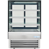 A commercial refrigerated display case with a glass front and sides, four white shelves, and a stainless steel base. The unit is empty and brightly lit with LED lighting from the top, featuring the Empura brand on the bottom right corner.