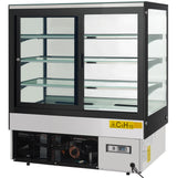 A commercial Empura refrigeration display case with glass panels on all sides, three stainless steel shelves, and sliding glass doors at the back. The lower section features a visible cooling unit and a digital temperature display showing -5.7°C.