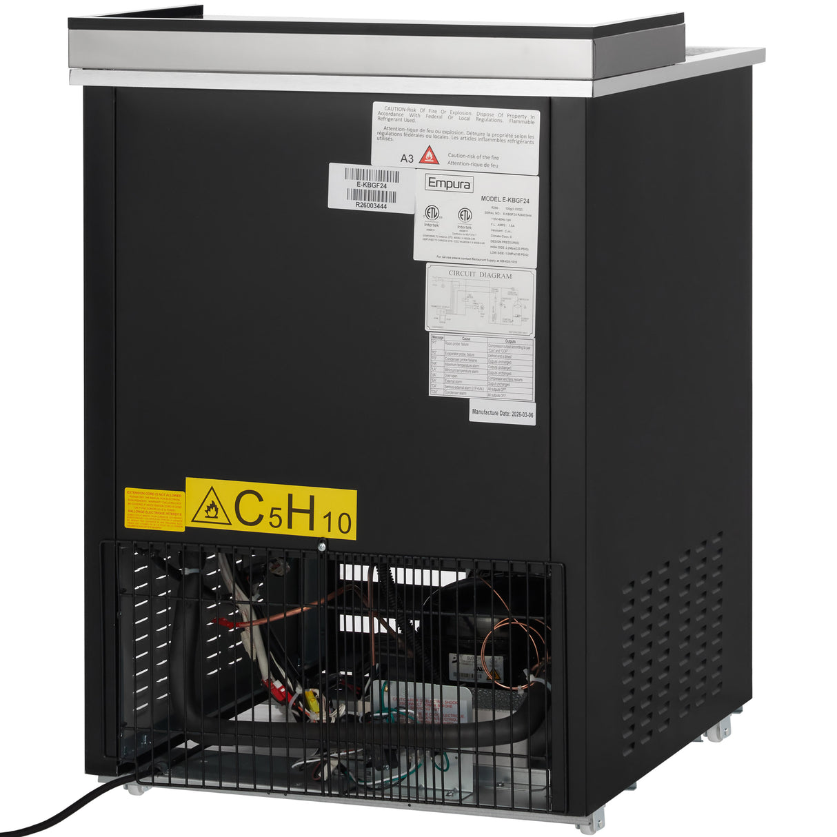 A black Empura Refrigeration commercial ice machine with a stainless steel top, viewed from the back. The lower panel is open, revealing internal wiring and pipes. Warning and information labels, including a yellow C5H10 sign, are on the upper rear panel.
