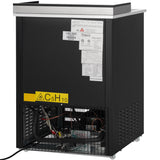A black Empura Refrigeration commercial ice machine with a stainless steel top, viewed from the back. The lower panel is open, revealing internal wiring and pipes. Warning and information labels, including a yellow C5H10 sign, are on the upper rear panel.