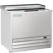 A stainless steel Empura refrigeration commercial bottle cooler features a top sliding lid, digital temperature display, metal label on the front, and bottom right ventilation grilles. Its reflective surface and clean, modern lines highlight premium commercial freezer quality.