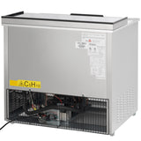 An Empura refrigeration unit with a stainless steel body is shown. The back lower panel is open, exposing wiring and electrical components. A yellow C5H10 chemical label and several information stickers are attached to the upper back panel.