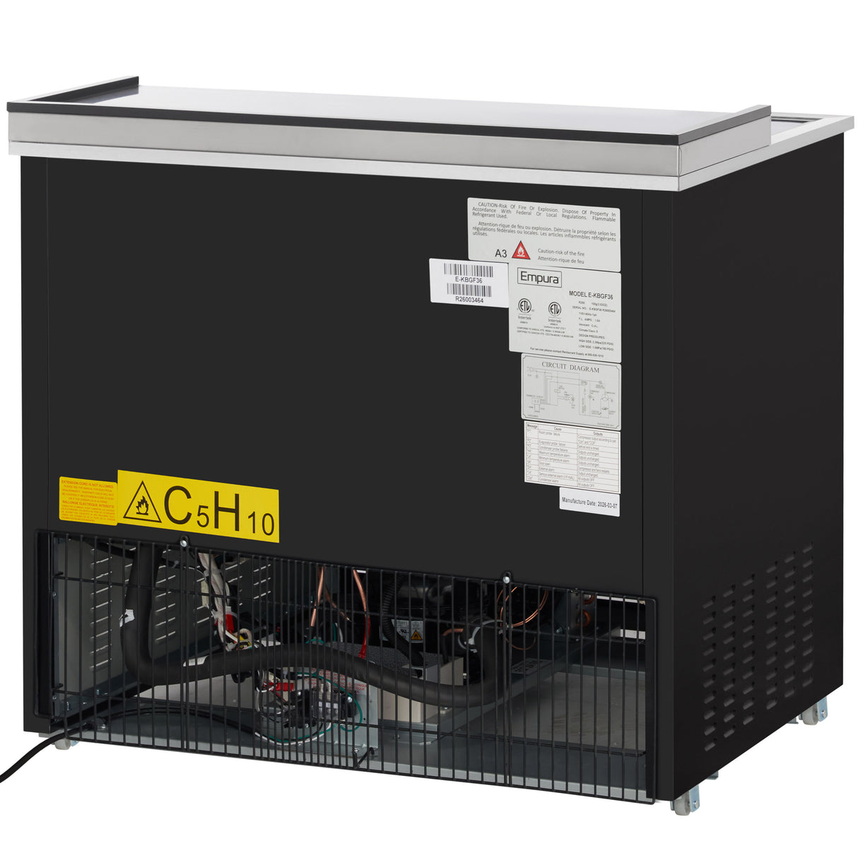 A commercial Empura Refrigeration unit with a black exterior, open vented lower panel revealing internal components, and several warning and instruction labels, including a large yellow flammable gas label marked C5H10, attached to the back.