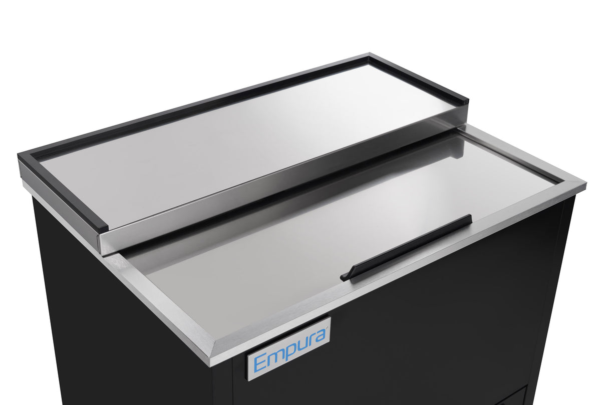 A close-up of a sleek stainless steel Empura Refrigeration commercial cooler with a sliding top lid and rectangular handle. The black unit, featuring the “Empura” label, showcases modern Stainless Steel Refrigeration against a white background.