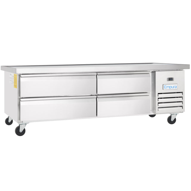 A long, stainless steel Empura refrigeration unit with four pull-out drawers, a flat top, sturdy black wheels, and a vented cooling system on the right. This Refrigerated equipment stand features a digital temperature display and Empura brand logo on the front.