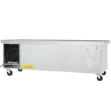 A large Empura refrigeration unit, this stainless steel refrigerated equipment stand features four caster wheels, exposed cooling components on the left, a flat top surface, manufacturer labels, and a yellow caution sticker on the front panel.