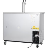 A large, stainless steel beer dispenser featuring a dual tap tower, visible compressor coils and fan on the lower right, warning labels, and four caster wheels for mobility.