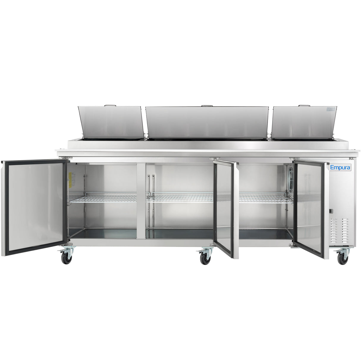 A large stainless steel Empura Refrigeration pizza prep table on wheels features three open top lids and three bottom doors revealing empty shelves. A vent is on the right, and the Empura logo appears on the front panel.