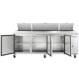A large stainless steel Empura Refrigeration pizza prep table on wheels features three open top lids and three bottom doors revealing empty shelves. A vent is on the right, and the Empura logo appears on the front panel.