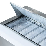 A stainless steel Empura Refrigeration freezer with a hinged lid is open, revealing multiple rows of clear, empty rectangular containers arranged neatly inside—ideal for use with a Mega Top Prep Table or as a refrigerated sandwich prep table.