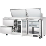 A large stainless steel Empura refrigeration unit, designed like a mega top prep table, with two lift-up lids, two open front doors revealing empty shelves, and two side drawers; on wheels with a digital display at the lower right.