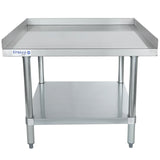 A stainless steel work table with an Empura logo, NSF-certified for safety, features raised edges on three sides, four cylindrical legs, a stainless steel top shelf, and a lower shelf for extra storage. Clean, sturdy equipment stand designed for industrial or kitchen use.